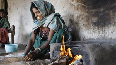 woman using a cookstove