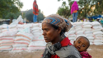 A woman carrying child at a temporary shelter in Tigray region, Ethiopia