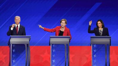 Democratic presidential candidates former Vice President Joe Biden, Massachusetts Sen. Elizabeth Warren and California Sen. Kamala Harris speak during the third Democratic debate in Houston on Sept. 12.