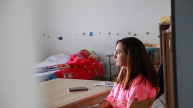 Natalia Babenko's 4-year-old daughter Mariia naps under a donated Frozen-themed blanket in a converted office building outside of Warsaw. They have been living here along with four other Ukrainian families since fleeing their homes in Mykolaiv, Ukraine.  