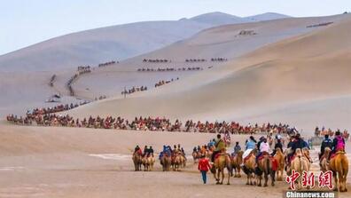 People visiting the city of Dunhuang in Gansu, an important international city on the Silk Road