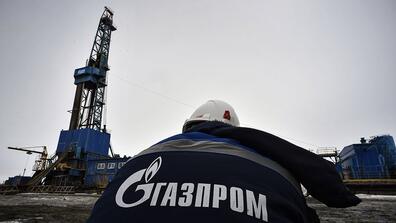 A worker wearing a Gazprom uniform