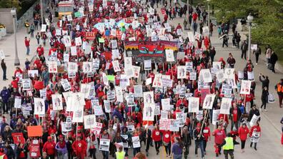 Teachers protest during a rally and march on the first day of a teacher strike in Chicago, Illinois, on 17 October. 