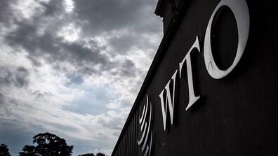 Image of a wall with WTO symbol and initials on it
