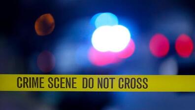 A crime scene tape that reads "Crime Scene Do Not Cross"