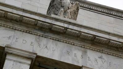 An eagle tops the U.S. Federal Reserve building's facade in Washington, July 31, 2013. REUTERS/Jonathan Ernst/File Photo
