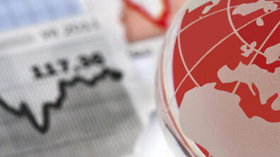 A globe and a line graph