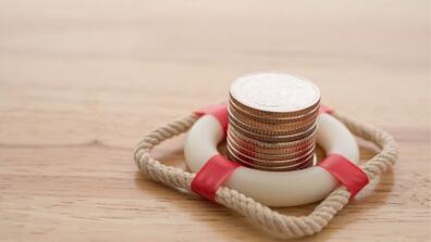 coins in the center of a lifeguard inner tube