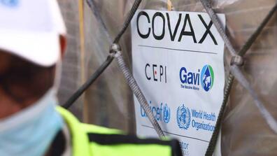 Closeup of a COVAX sign 