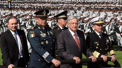 Mexican President Andres Manuel Lopez Obrador (Center), National Defence Secretary Luis Cresencio Sandoval (Left) and Navy Secretary admiral Jose Rafael Ojeda Duran attend the ceremony of deployment of Mexico's new National Guard force.