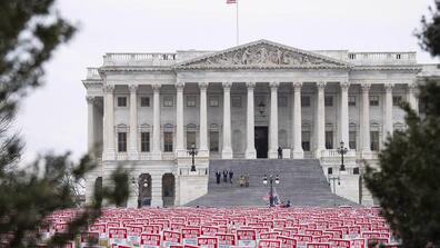 hundreds of signs reading "help still wanted" outside of the Capitol