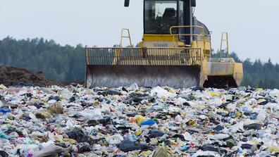 Waste sorting truck at a landfill