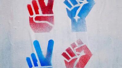 picture of red and blue thumbs ups, fists