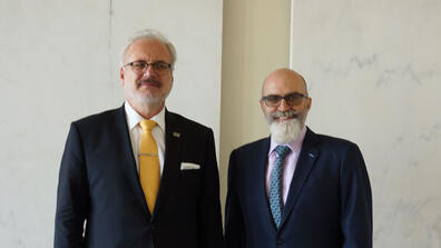 Latvian President Egils Levits with Senior Research Scholar Jason Healey.