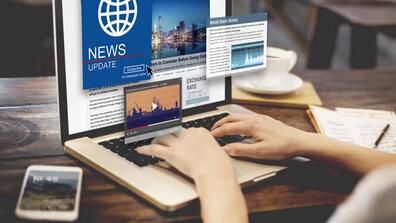 A person checking news from their laptop