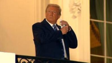 Trump takes off his face mask