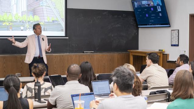 EMPA Class lecture: Instructor presenting architectural concepts to students in person and via video conference.