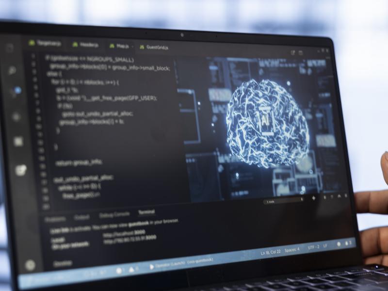 computer-scientist-using-laptop-data-center-updating-ai-freepik